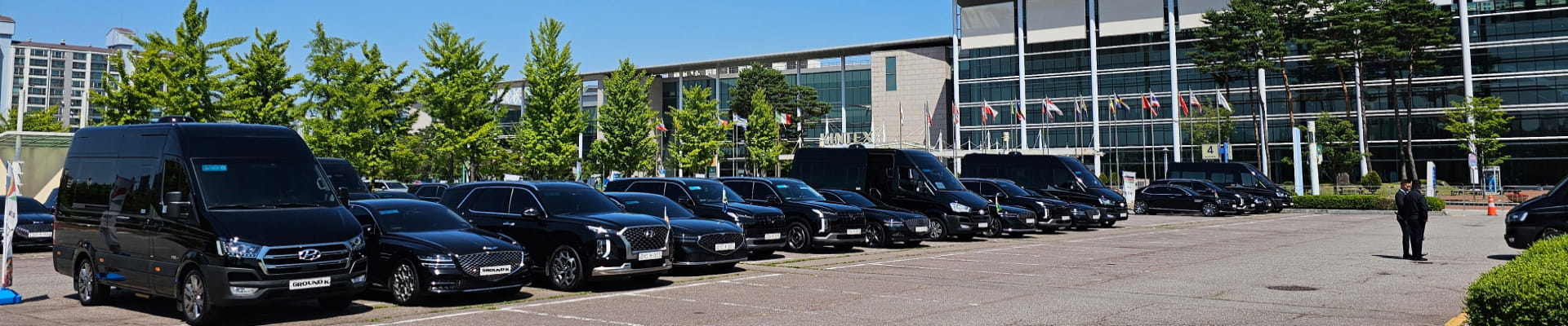 Various protocol vehicles parked in a parking lot.