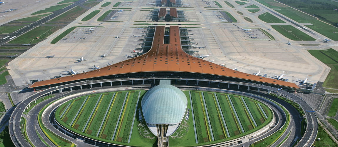 Beijing Capital International Airport from above, showcasing extensive runways and terminals.