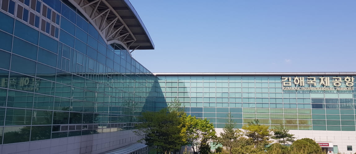 Gimhae International Airport terminal exterior, great for airport transfers and chauffeur services.