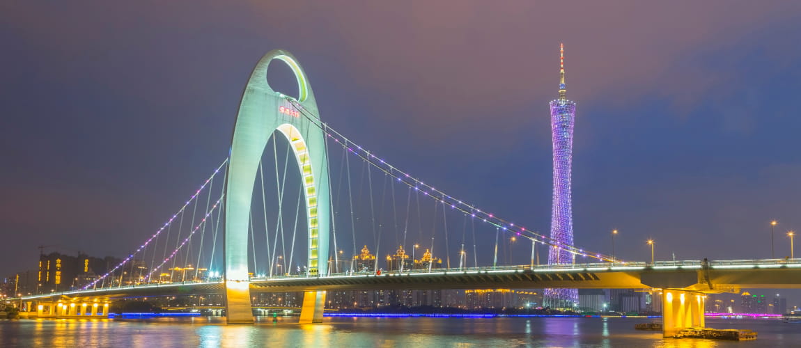 Haixinsha Bridge and Canton Tower lit up at night, perfect for sightseeing and luxury travel.