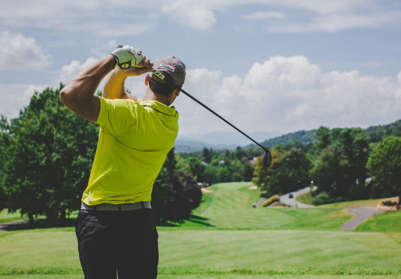 Golfer playing on a golf course.